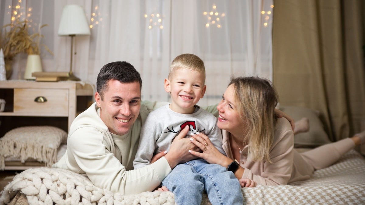 a family sitting on a couch
